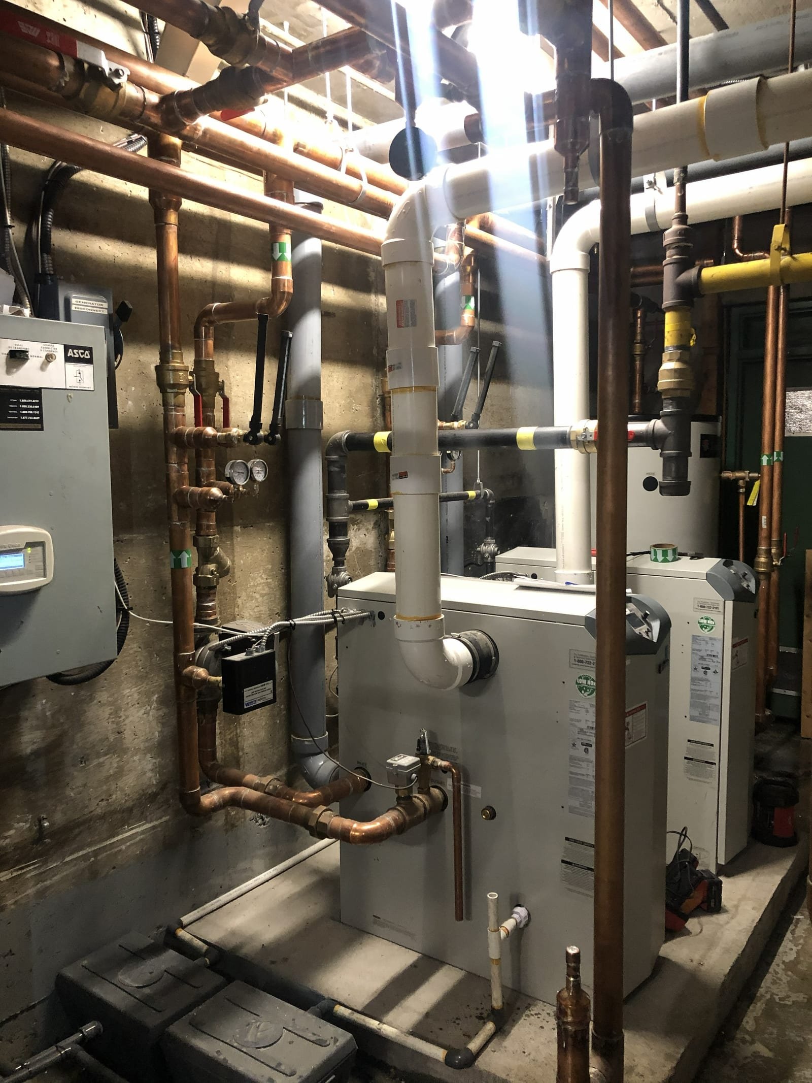 Boiler-room installation with hydronic piping and venting