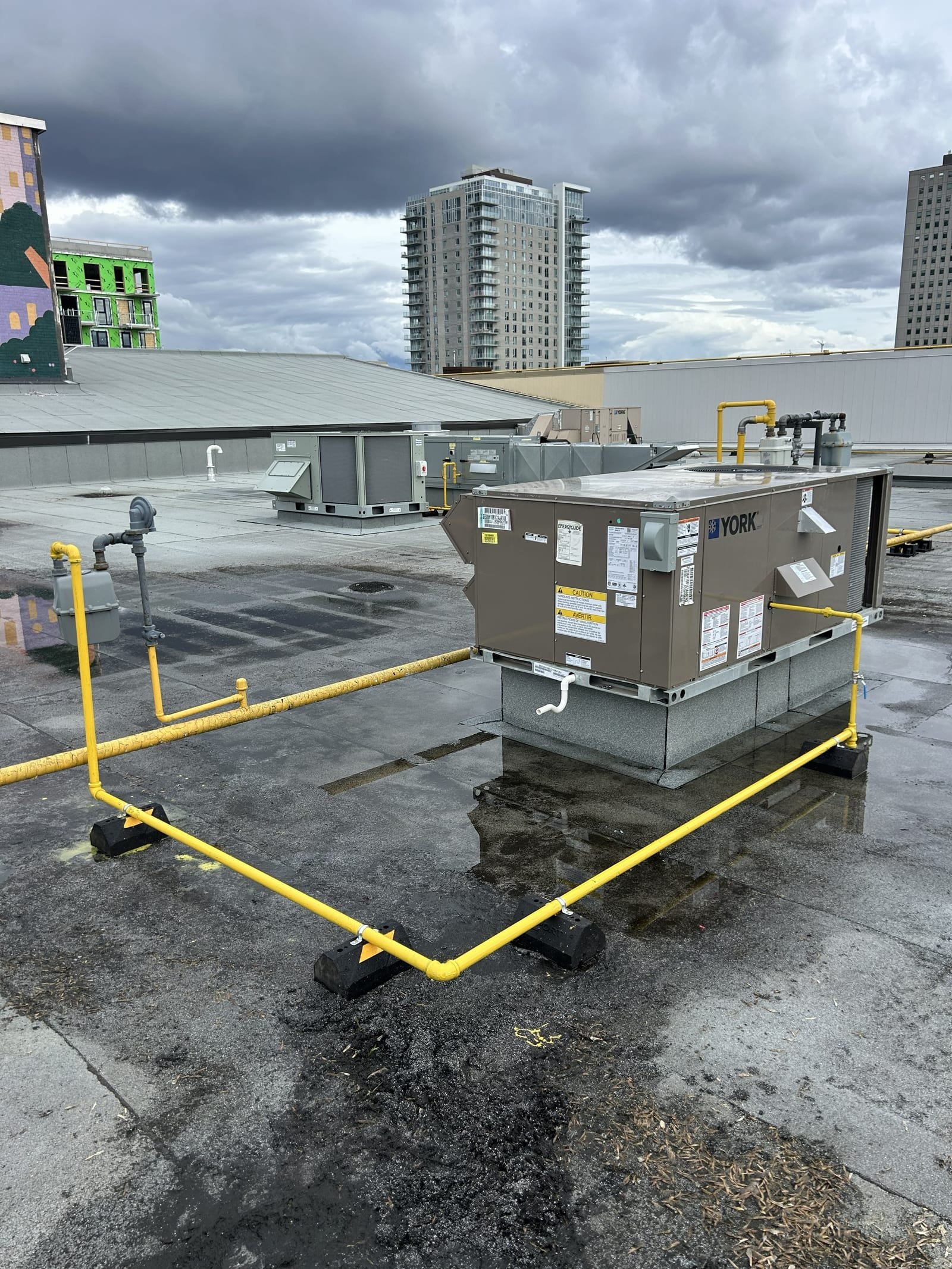 York rooftop HVAC unit with gas piping on a commercial roof